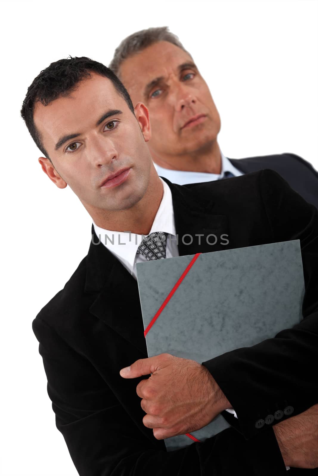 Two businessmen with documents by phovoir