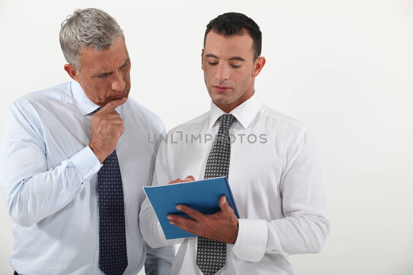 Two employees going over contract by phovoir