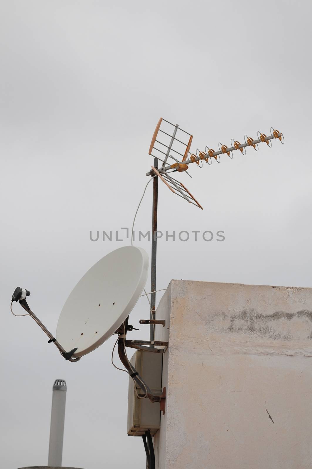 Antennas on a Roof over a Cloudy Sky by underworld