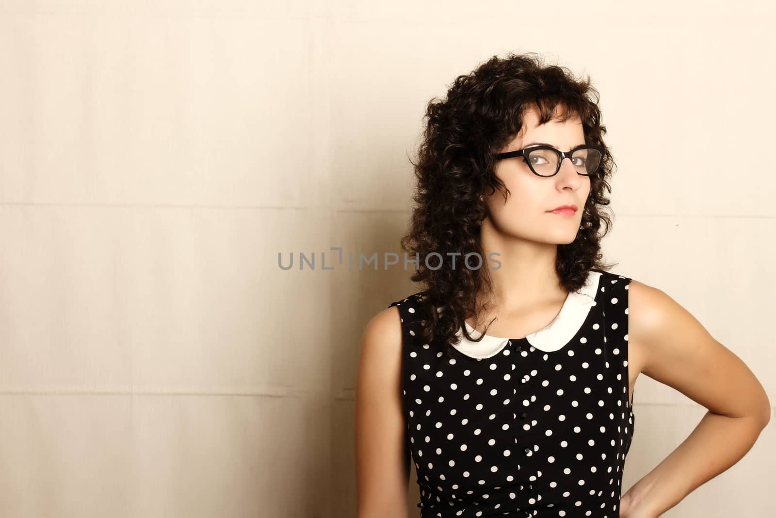 Portrait of a pensive woman in a vintage dress.