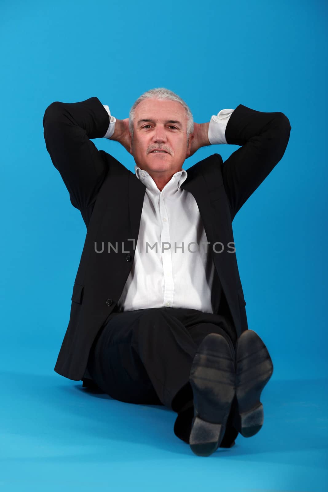 businessman relaxing on the floor