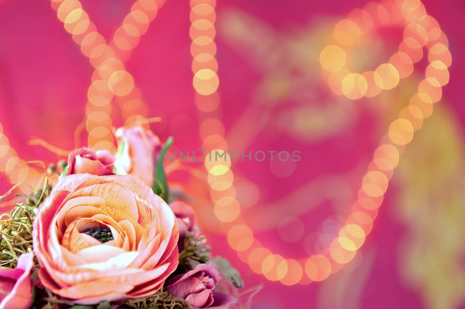 Pink background with lights and a flower
