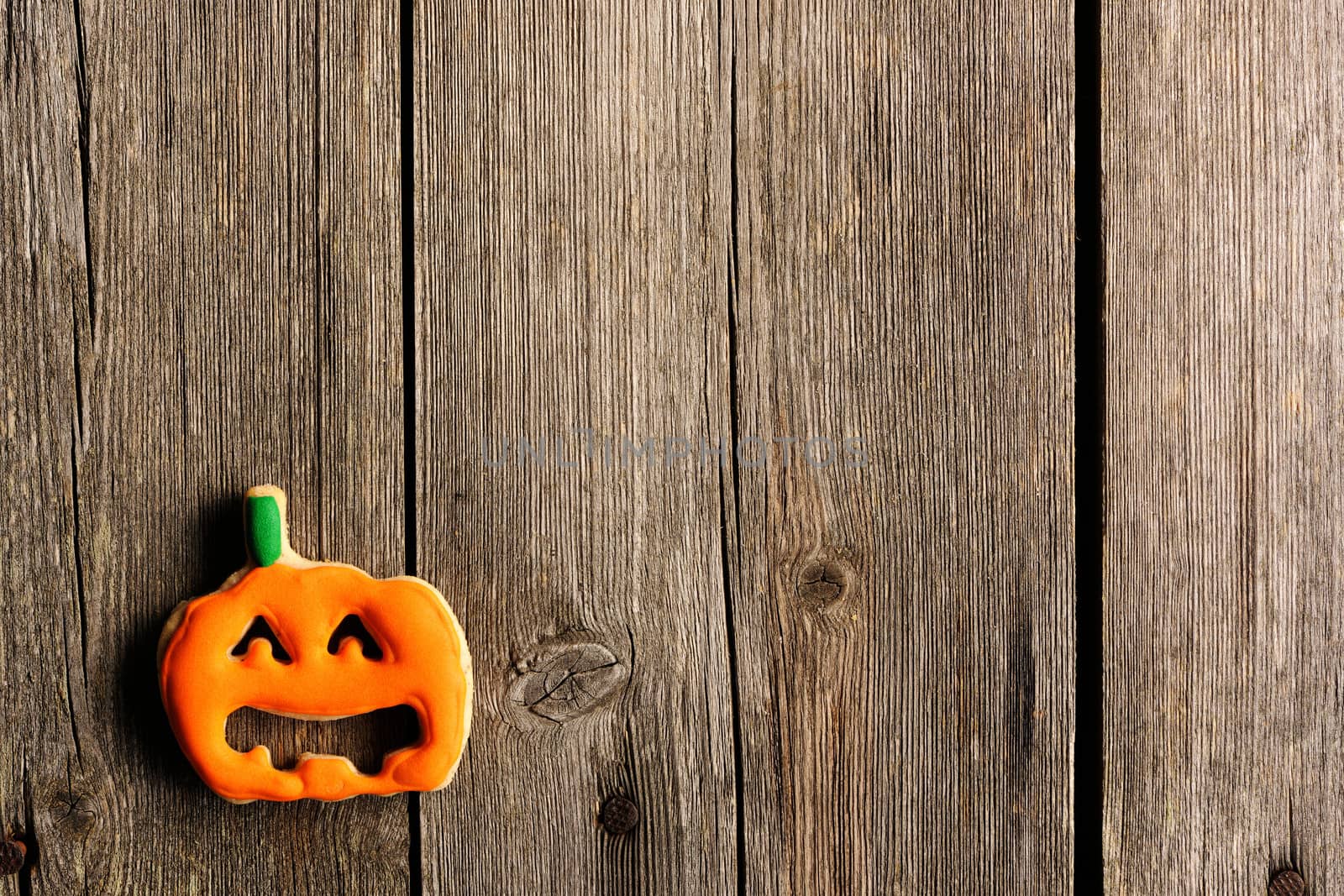 Halloween homemade gingerbread cookies over wooden table