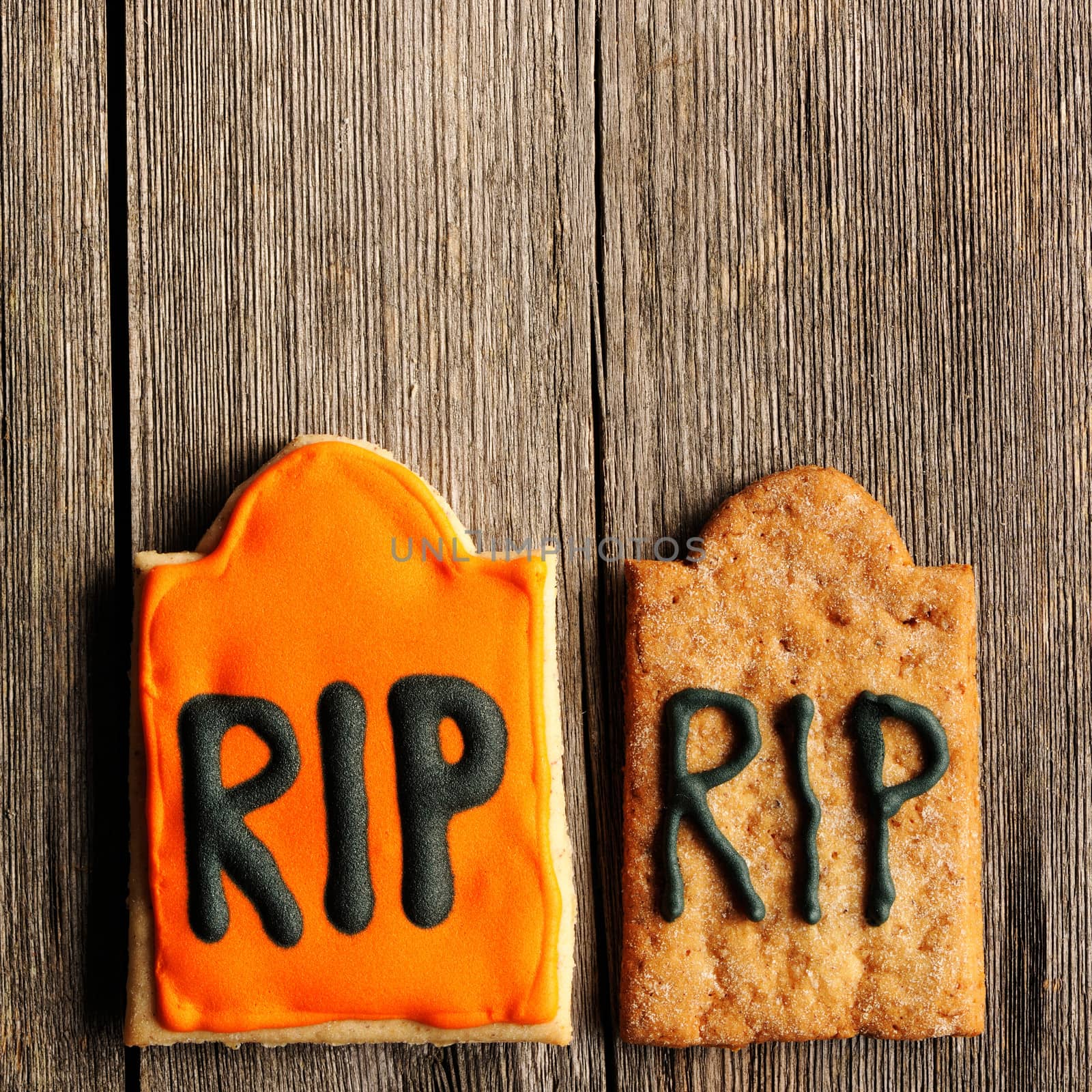 Halloween homemade gingerbread cookies over wooden table