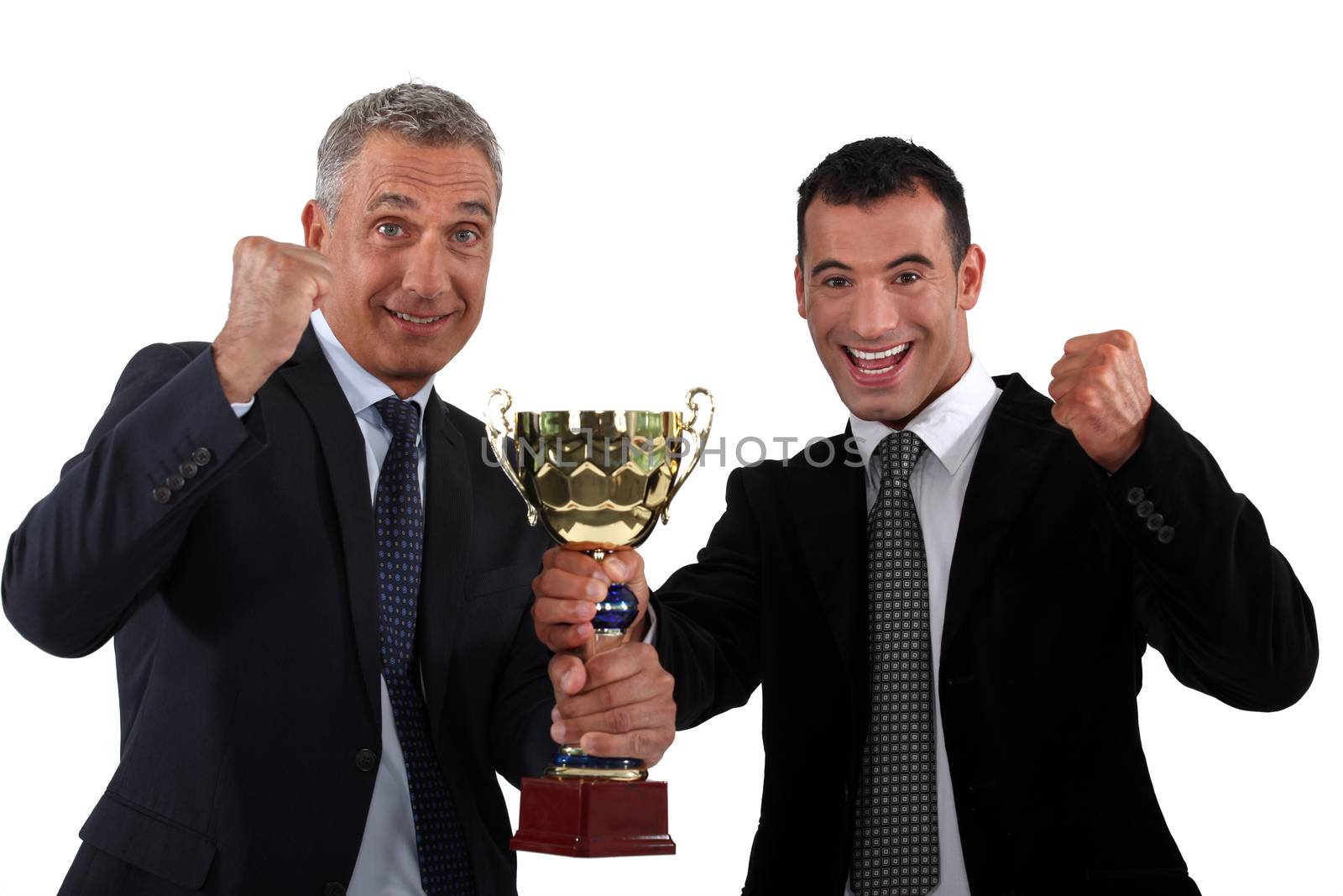 businessmen holding a golden cup by phovoir