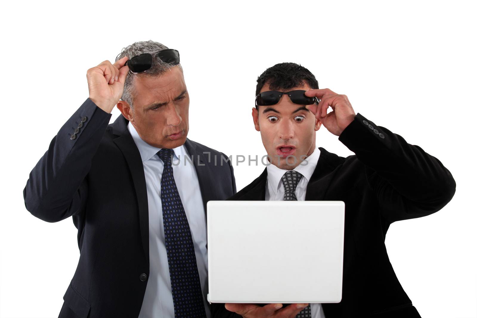 Two businessmen with shocked expression on face by phovoir
