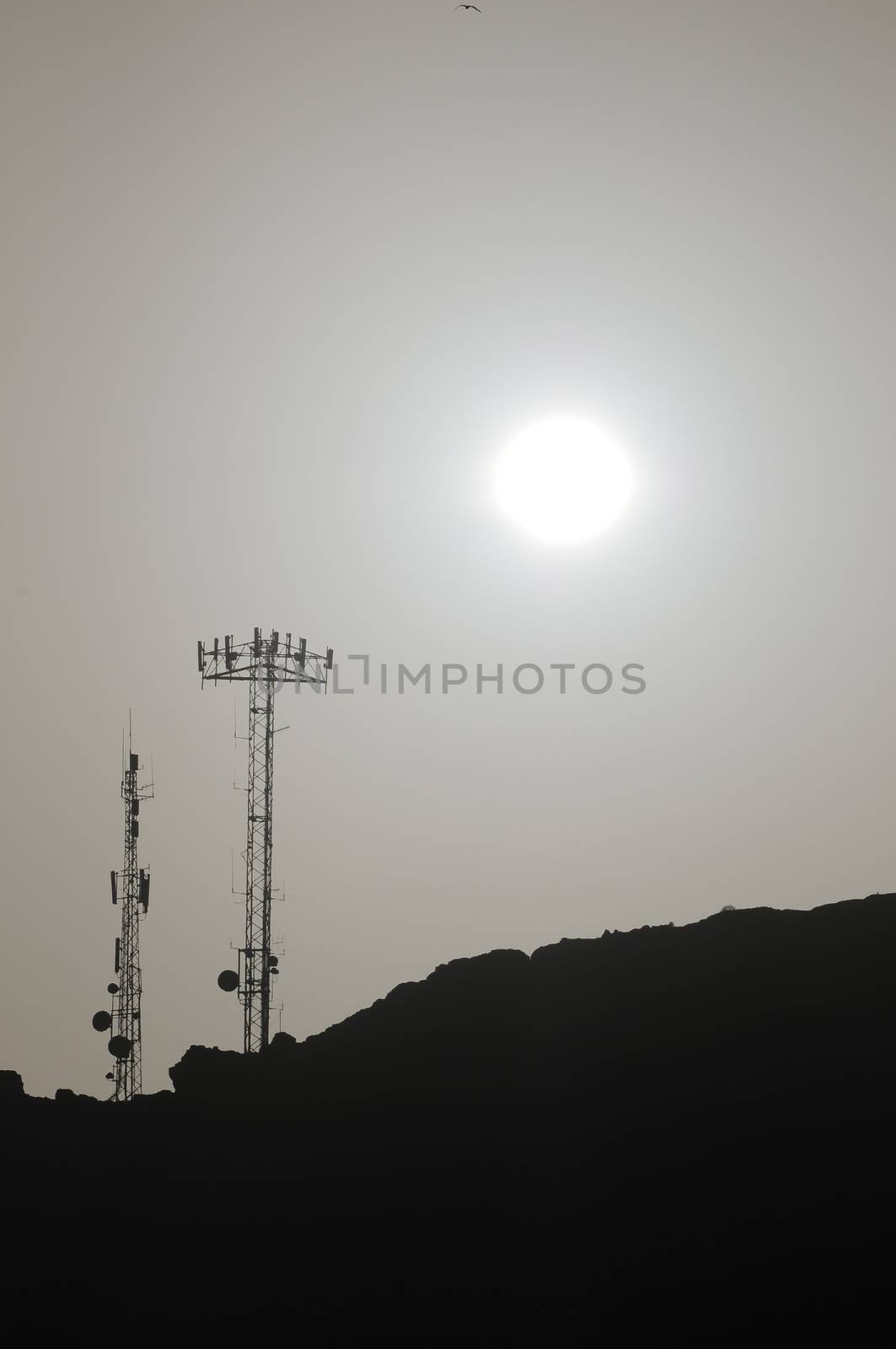 Some Silhouetted Antennas on the top of a Hill