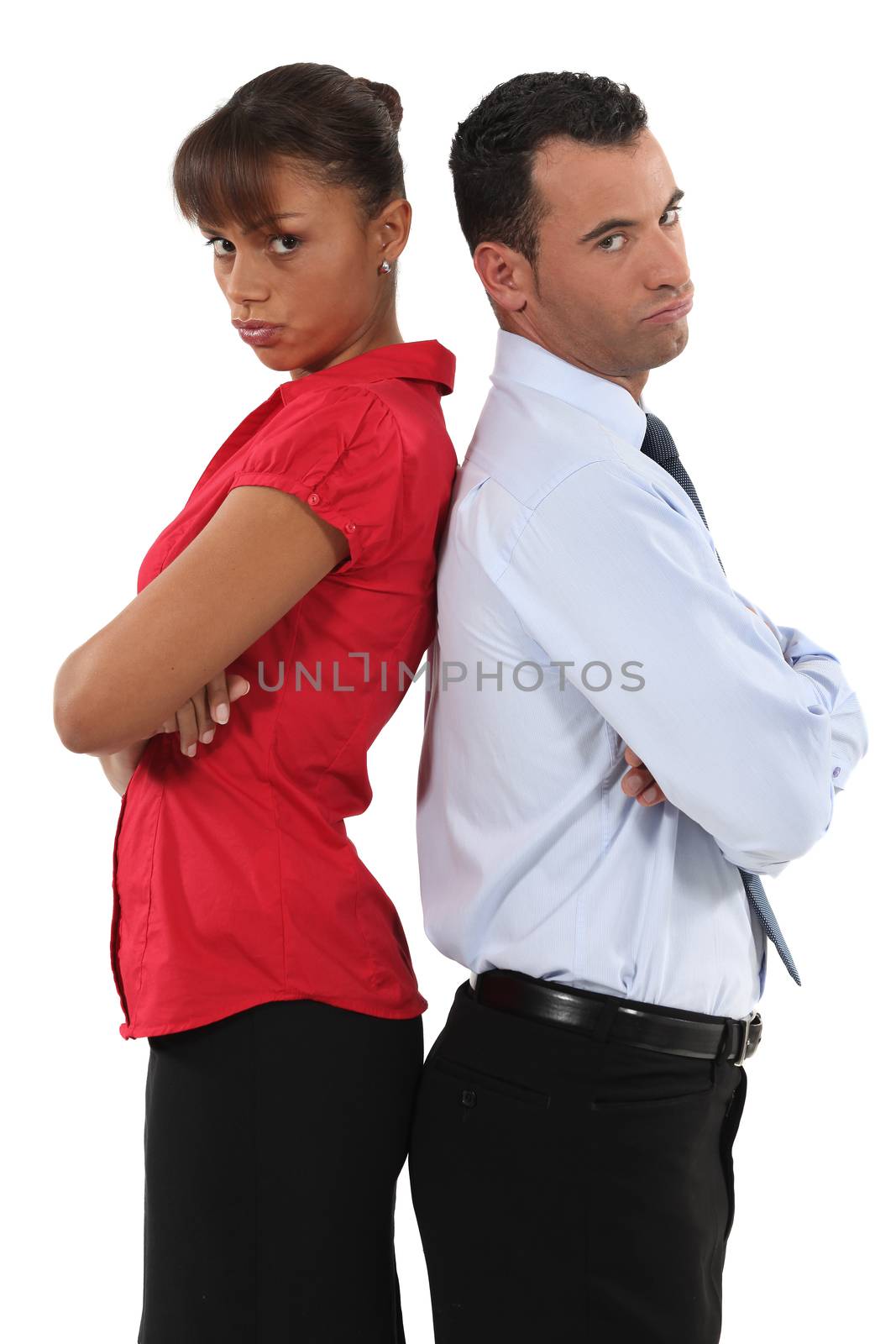 couple standing back to back after quarrel