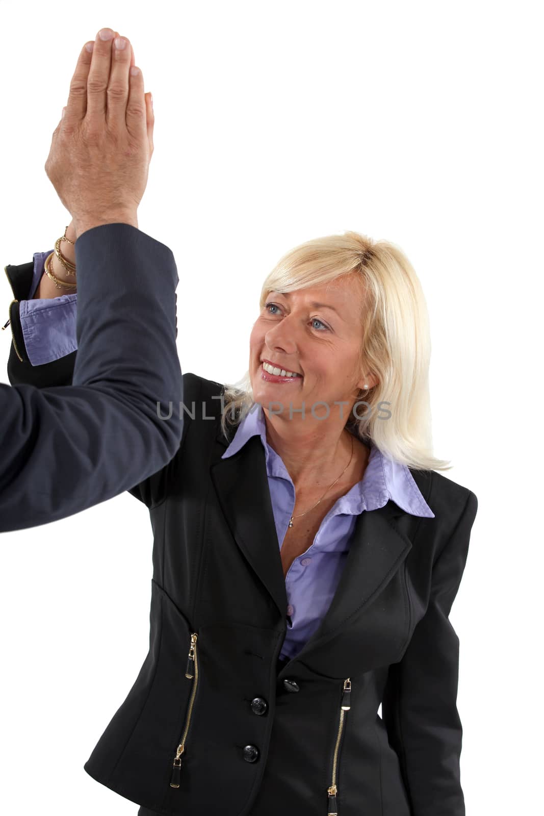 Senior businesswoman giving a high-five
