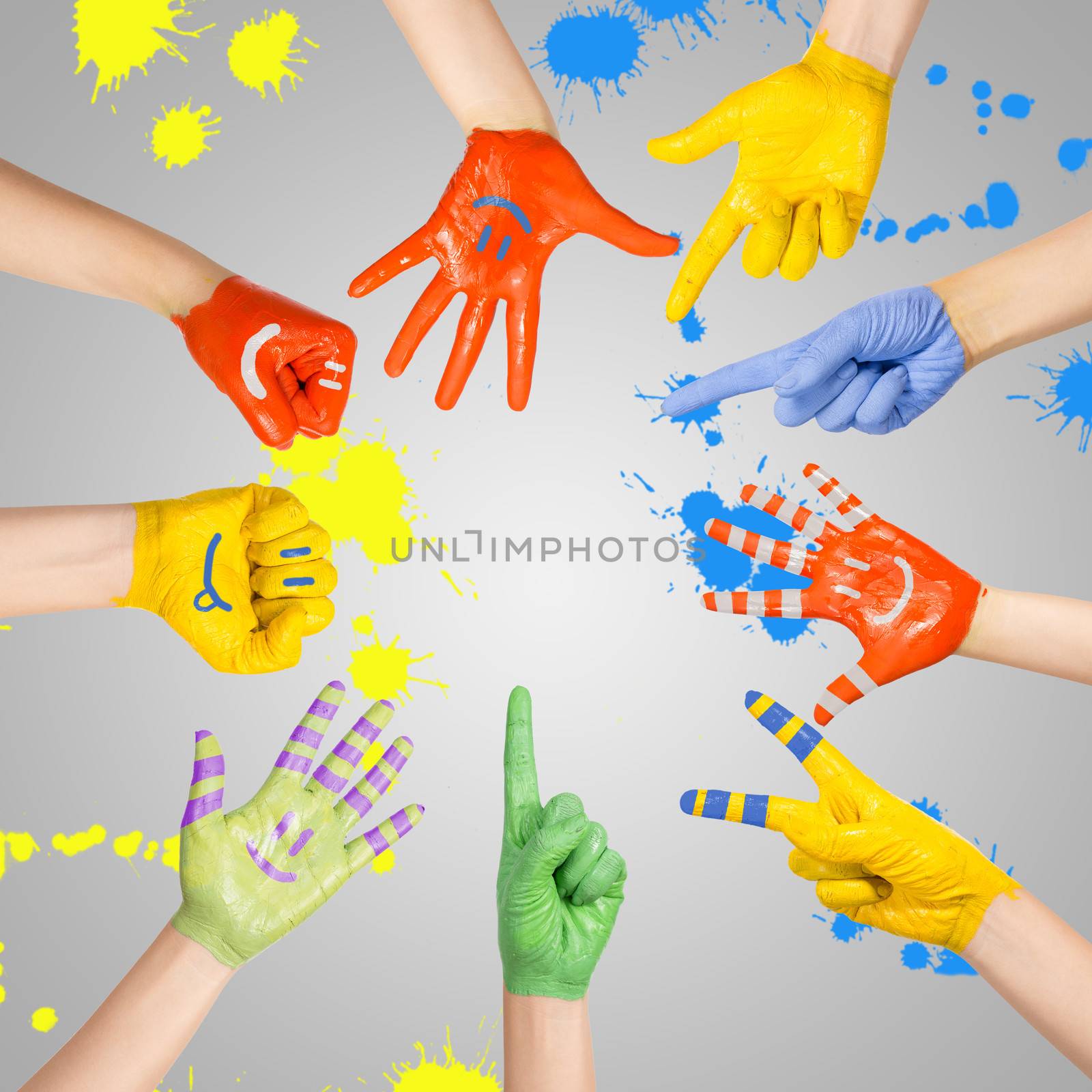 painted children's hands in different colors with smilies