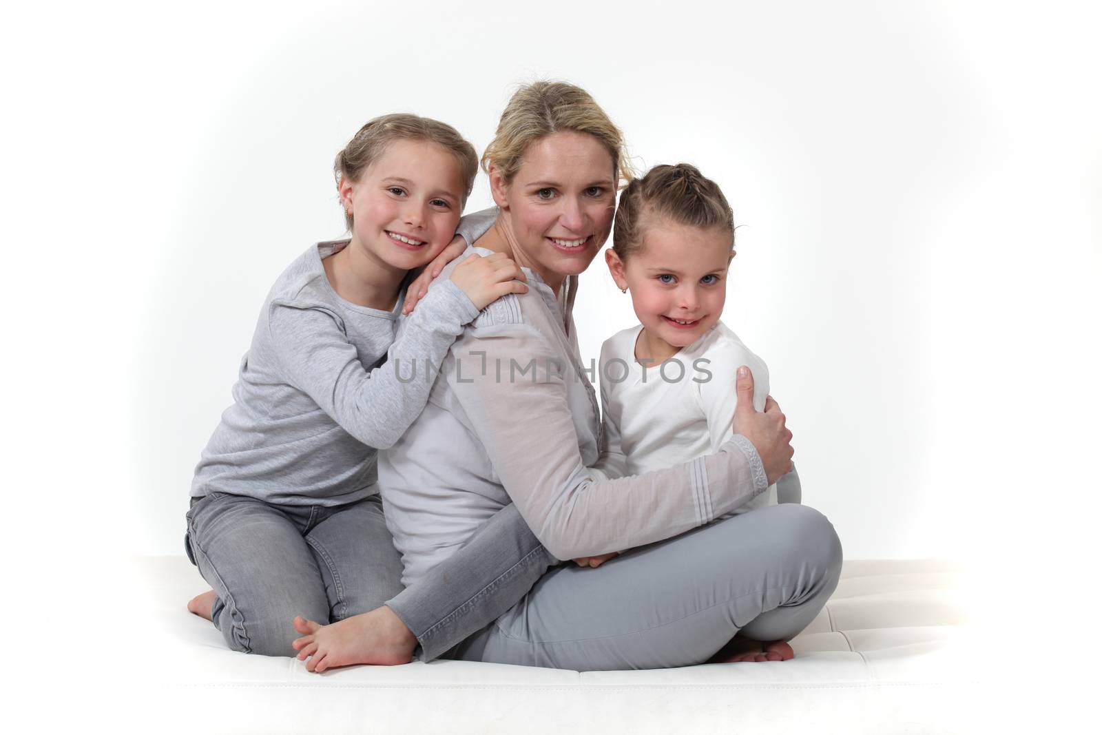 Woman hugging her children