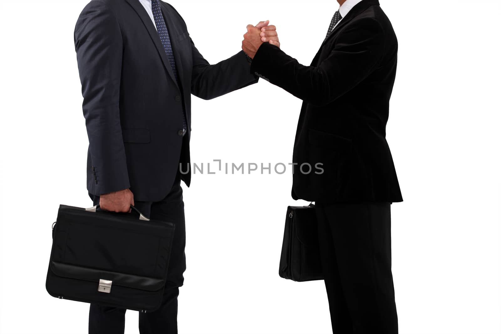Business partners handshaking by phovoir