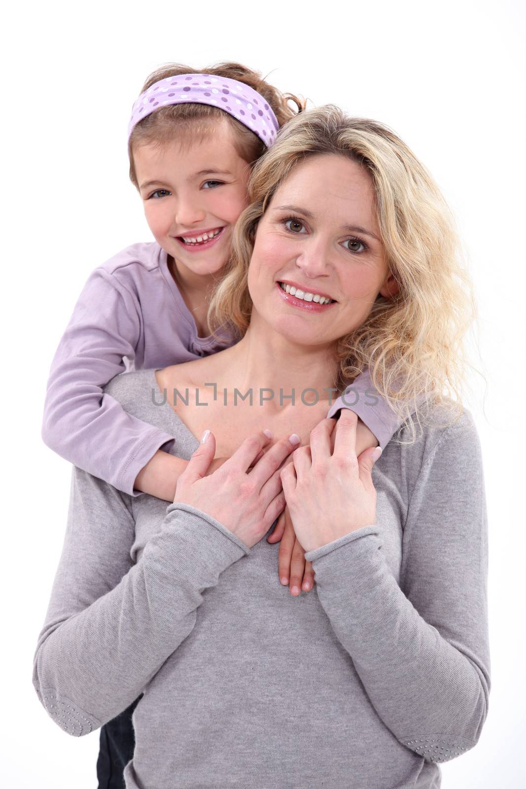 Daughter hugging her mom. by phovoir