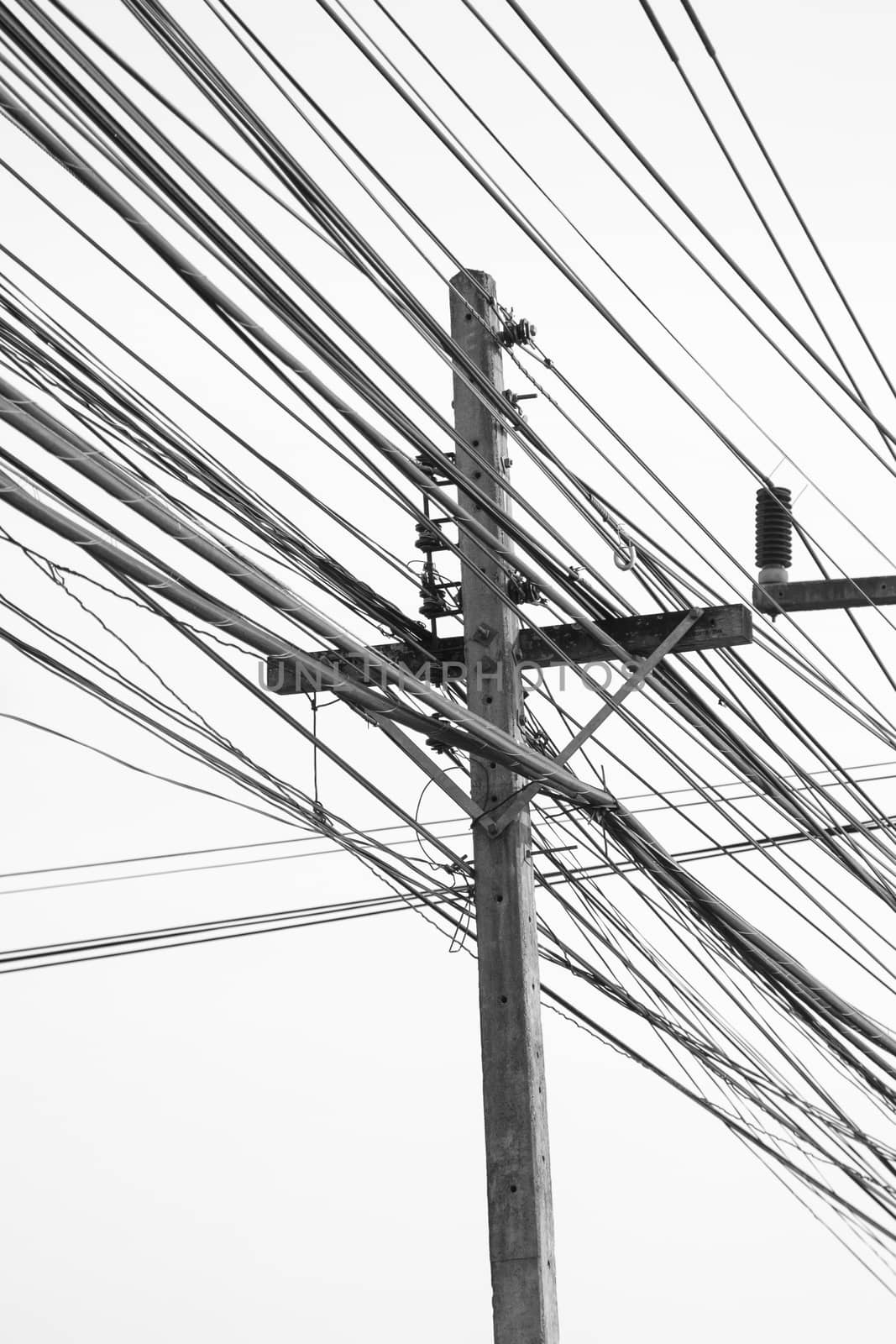 public electricity pole with many cable