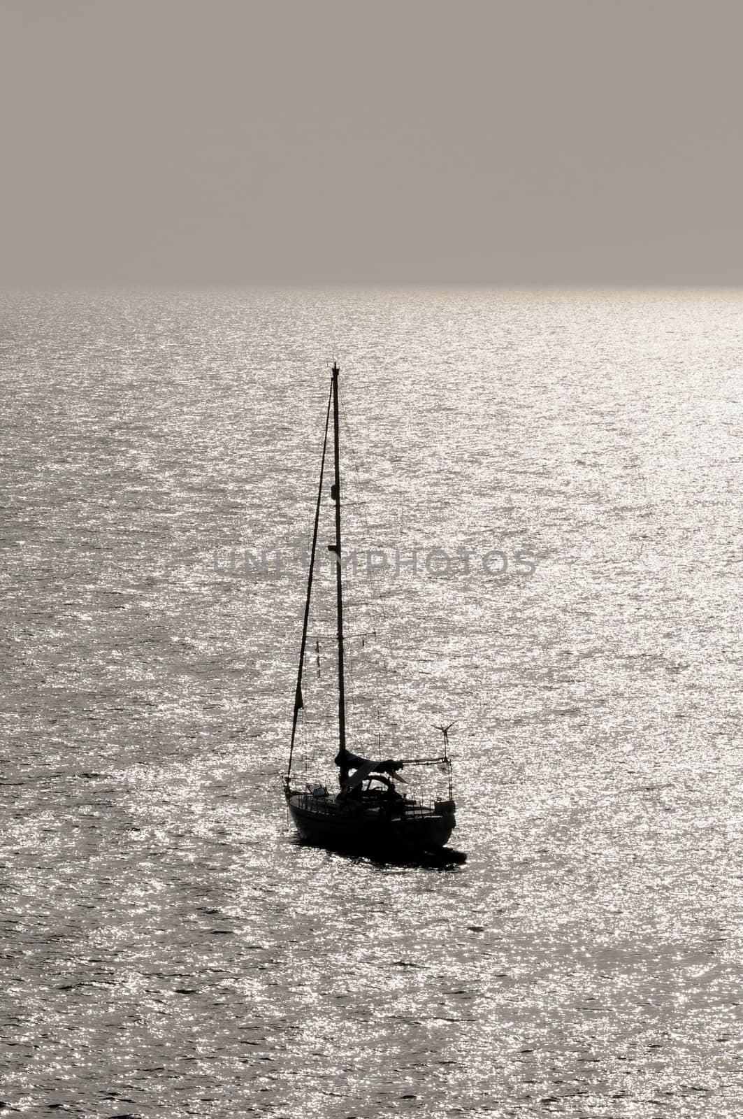 Silhouetted Sailing Boat by underworld