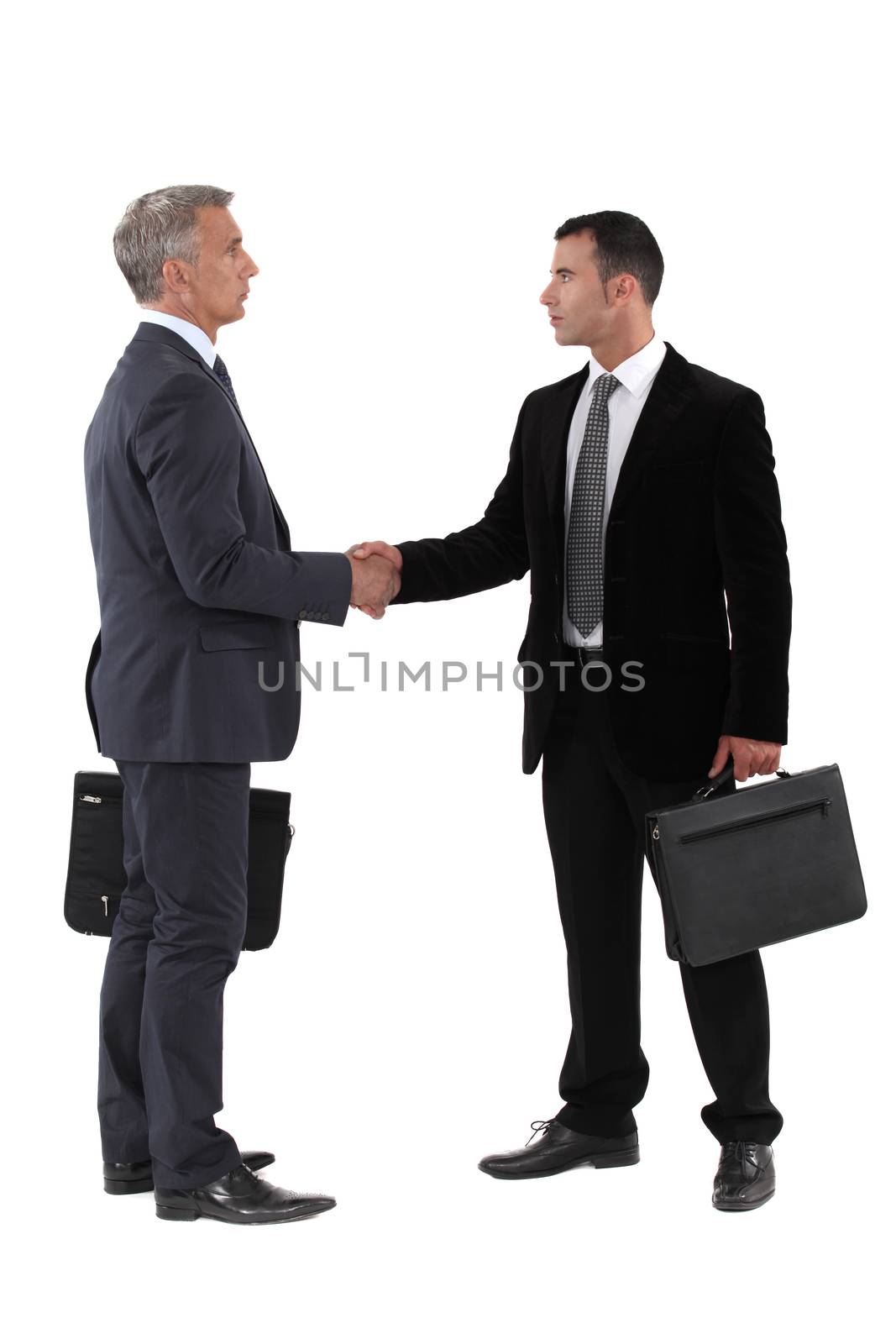 Business men shaking hands by phovoir
