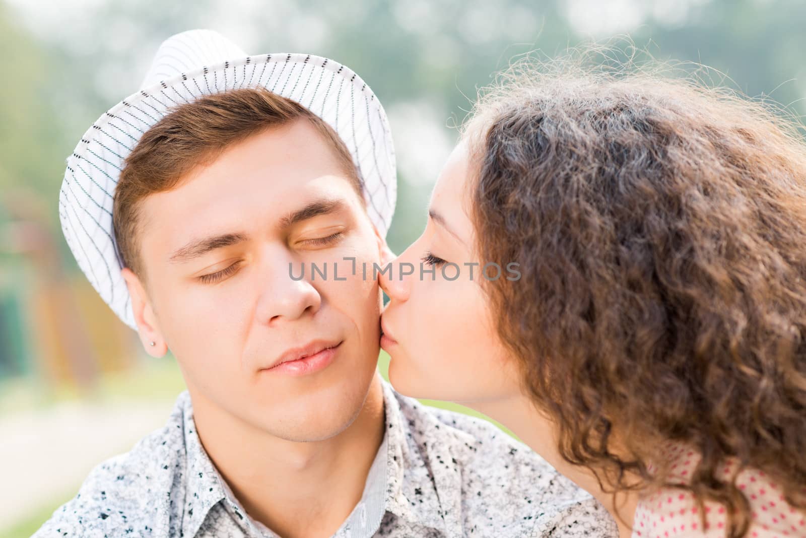 girl kissing a man on the cheek, spending time with loved ones