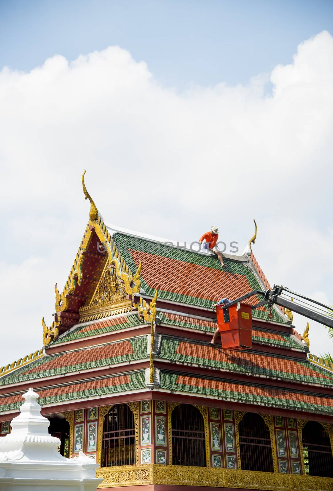 Men repair roof of Temple5