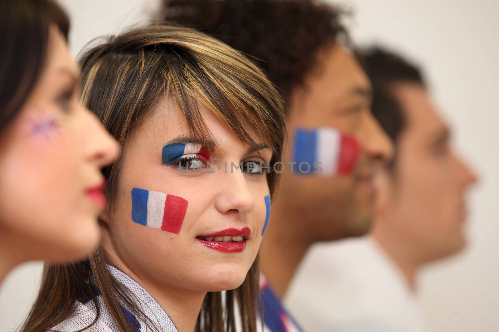 Friends watching the French team play a soccer game