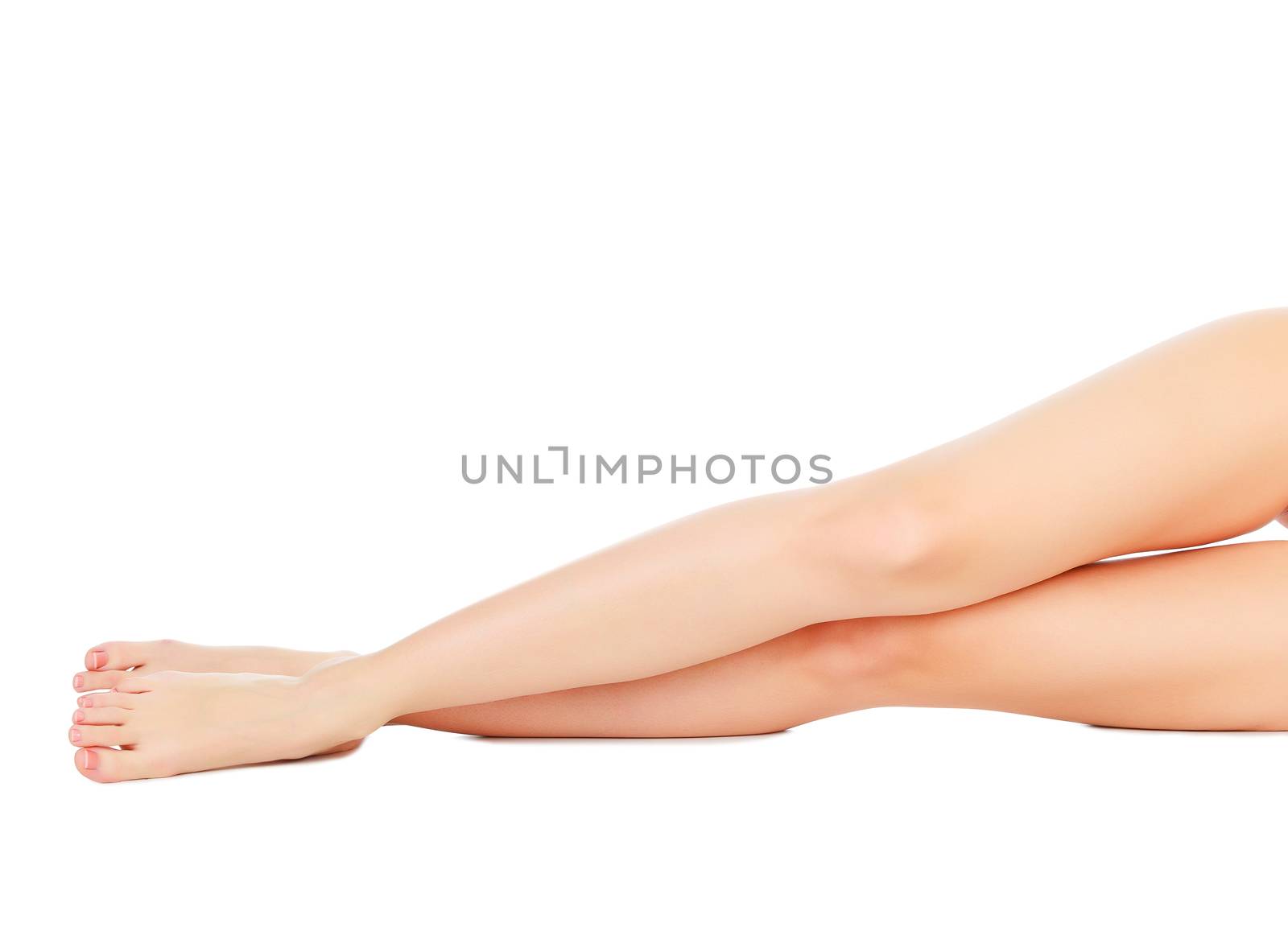 Beautiful woman legs against white background. by Nobilior
