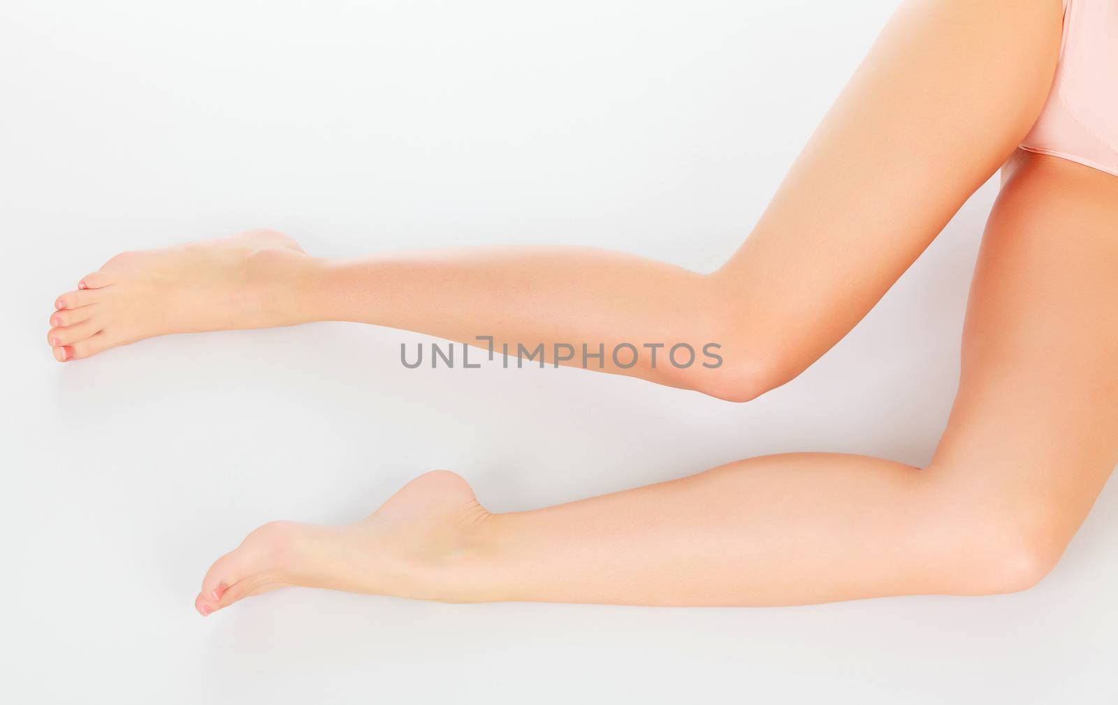 Beautiful woman legs against white background