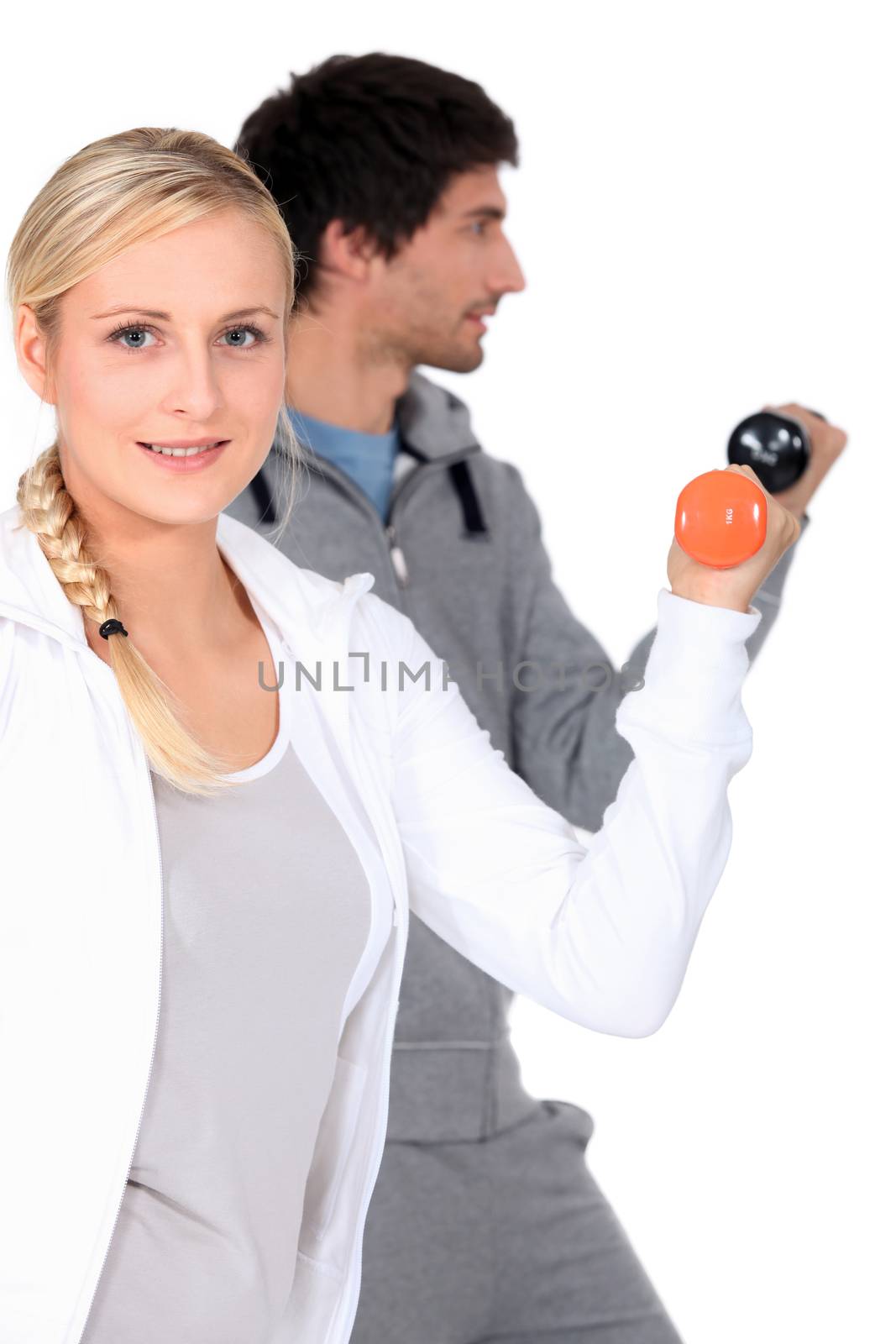 young man and woman doing their workout by phovoir