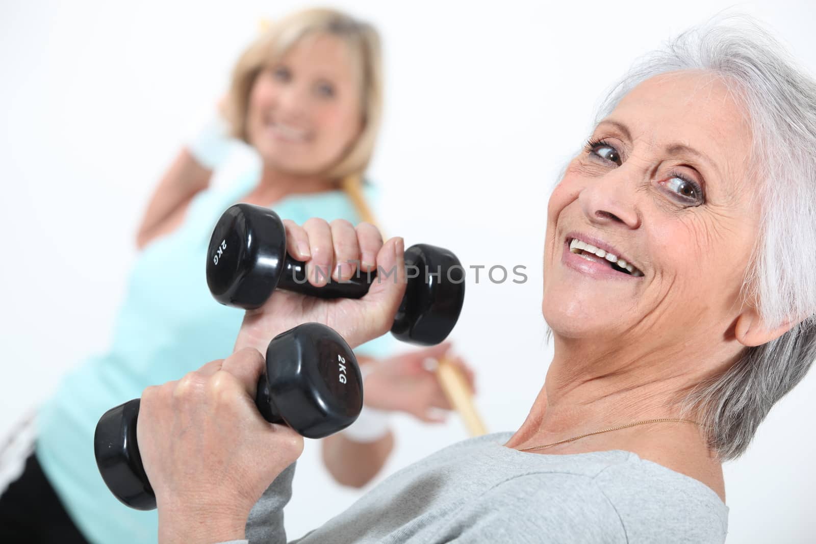 Elderly ladies in gym by phovoir