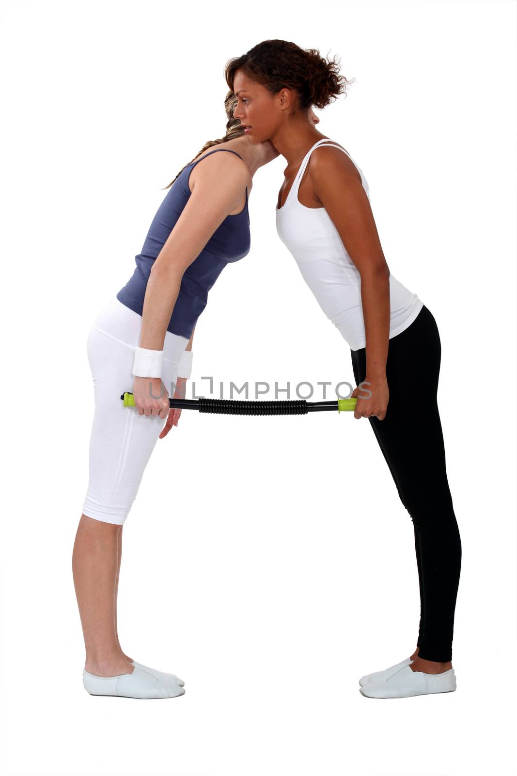 women doing exercises together by phovoir