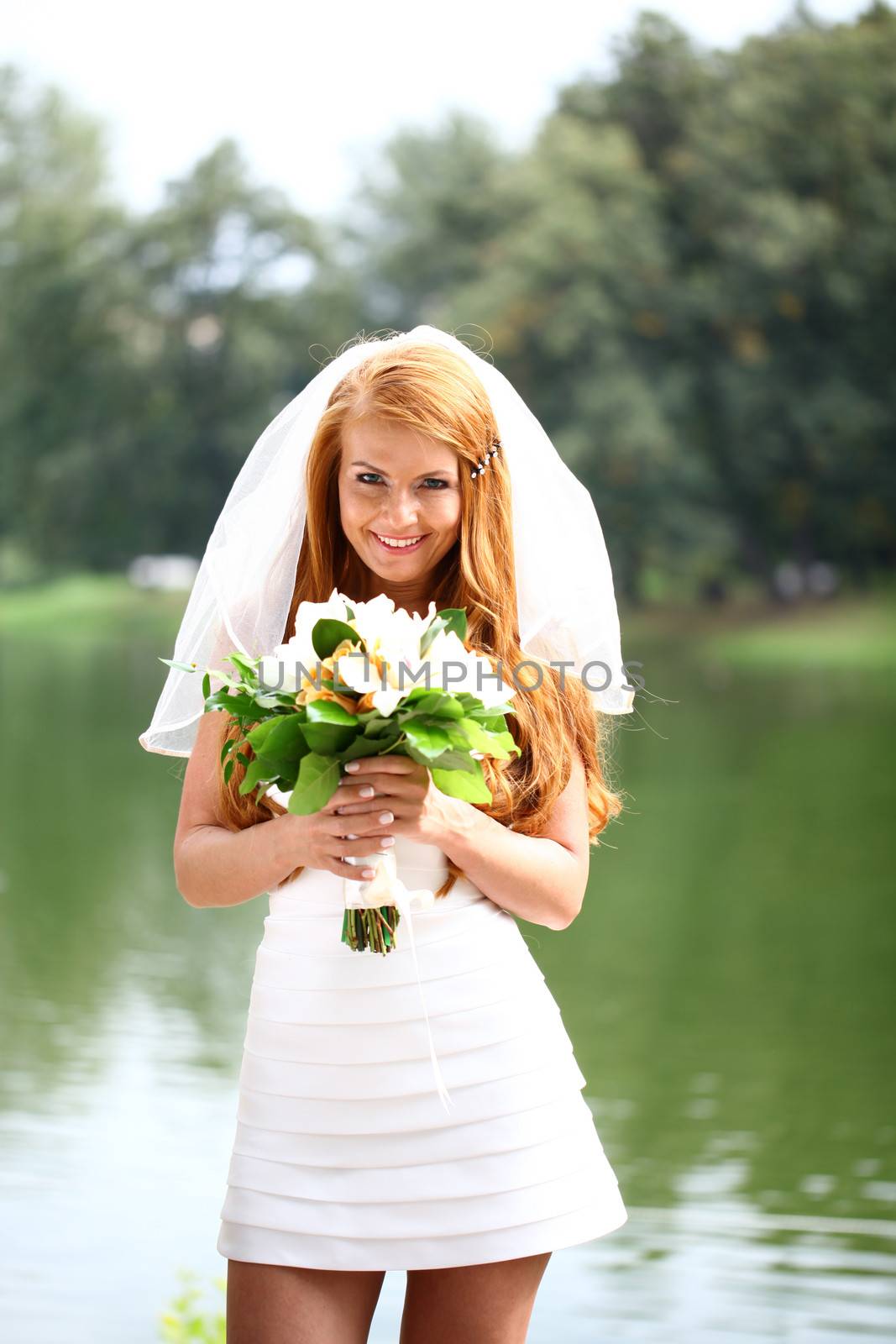 Portrait of beautiful bride with flowers