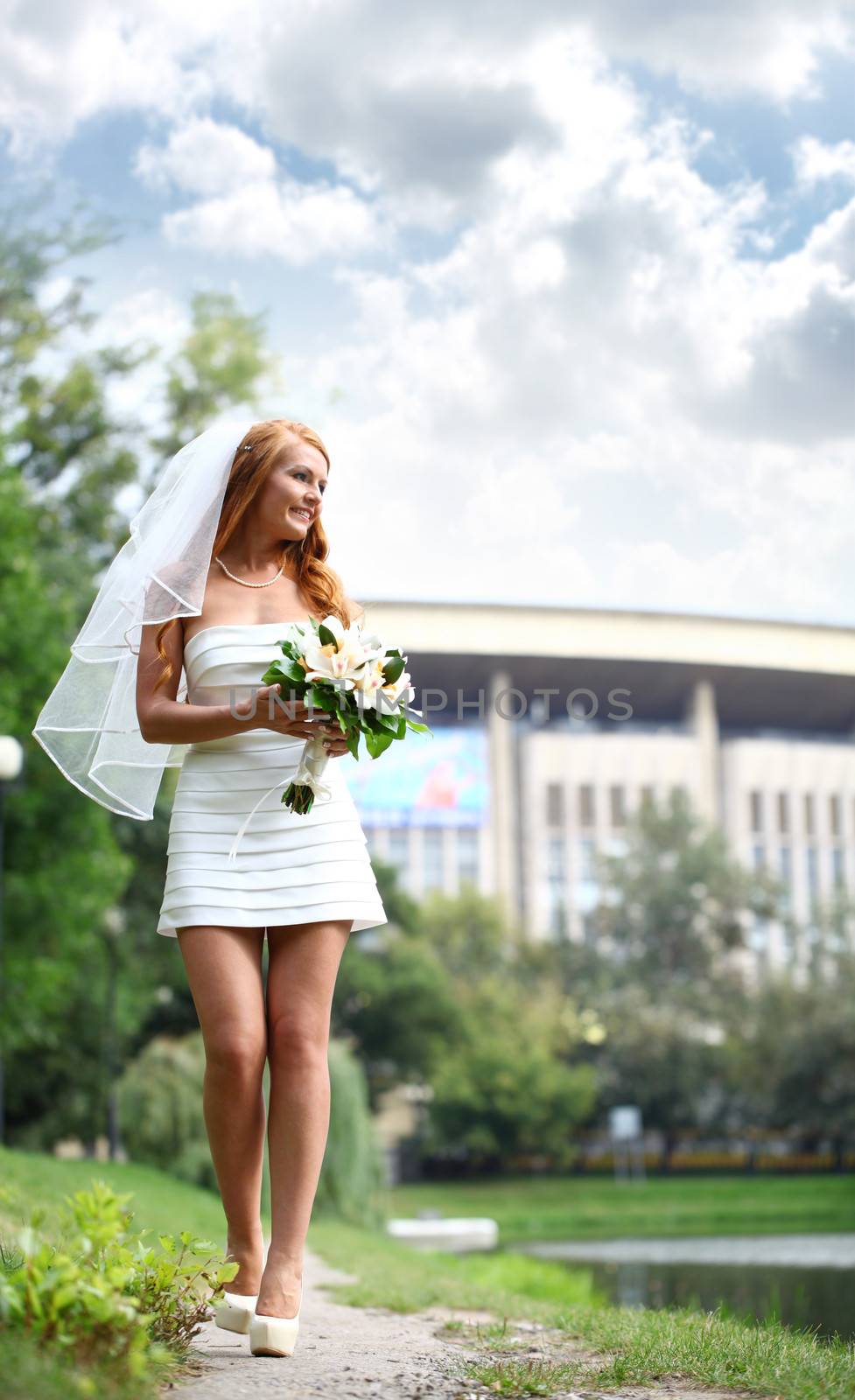 Beautiful red hair bride wearing wedding dress