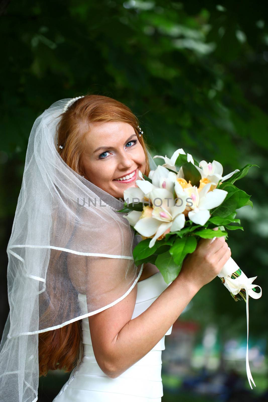 Portrait of beautiful bride with flowers