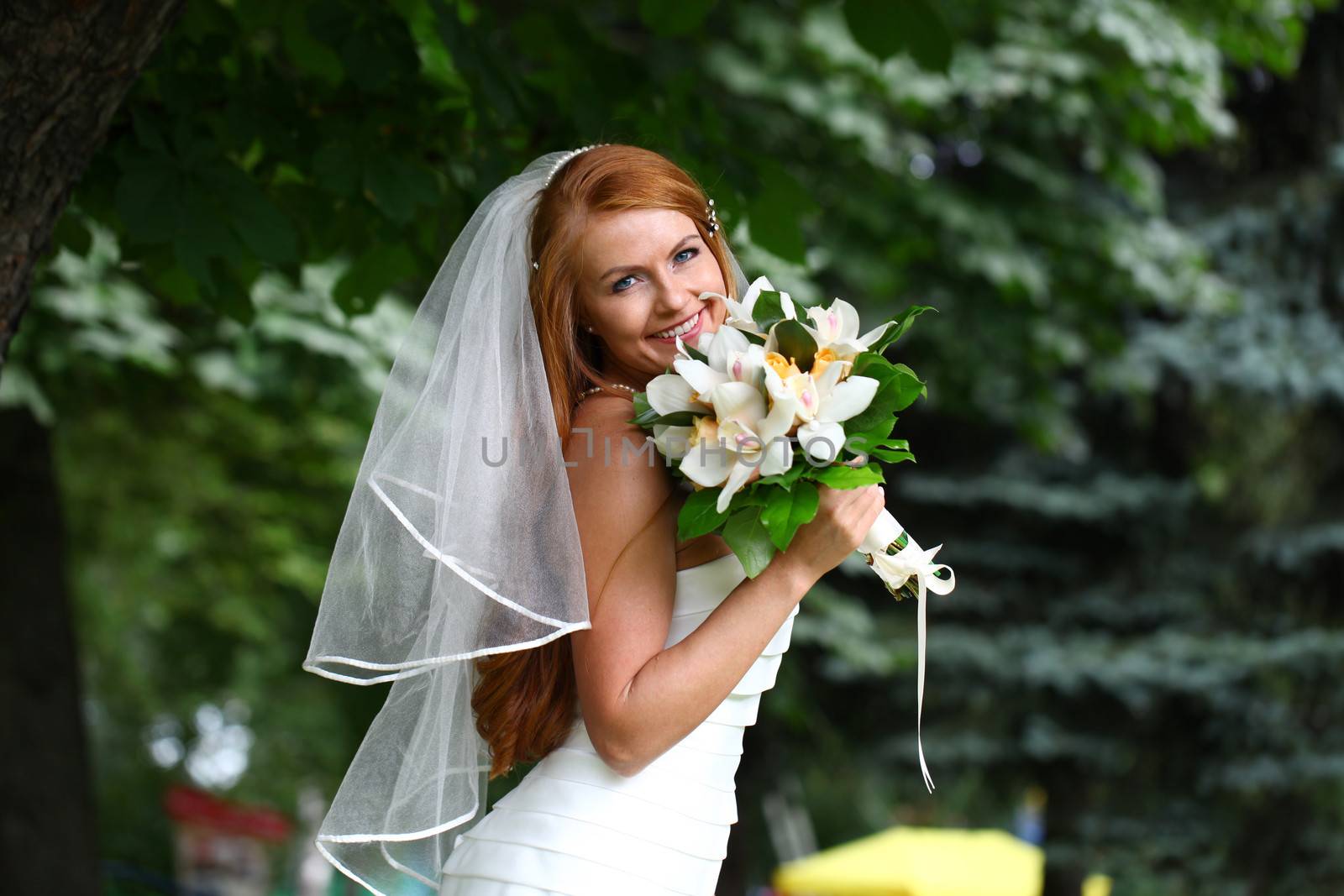 Portrait of beautiful bride with flowers