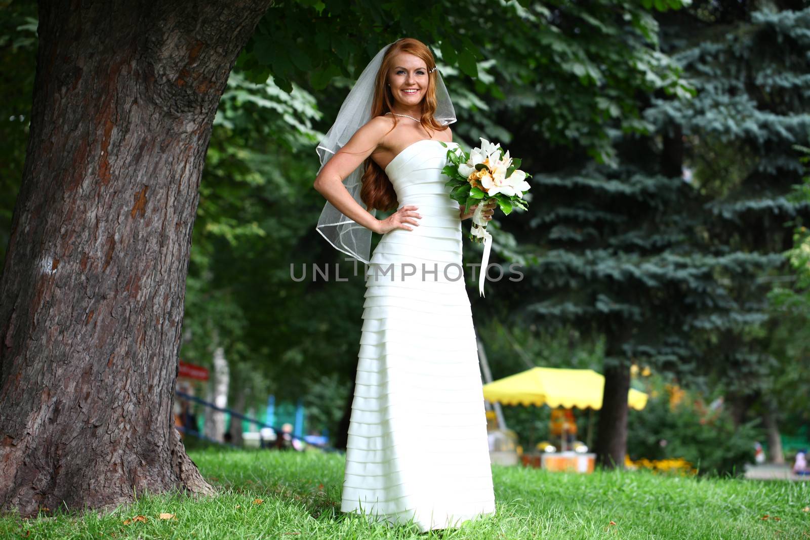 Beautiful red hair bride wearing wedding dress