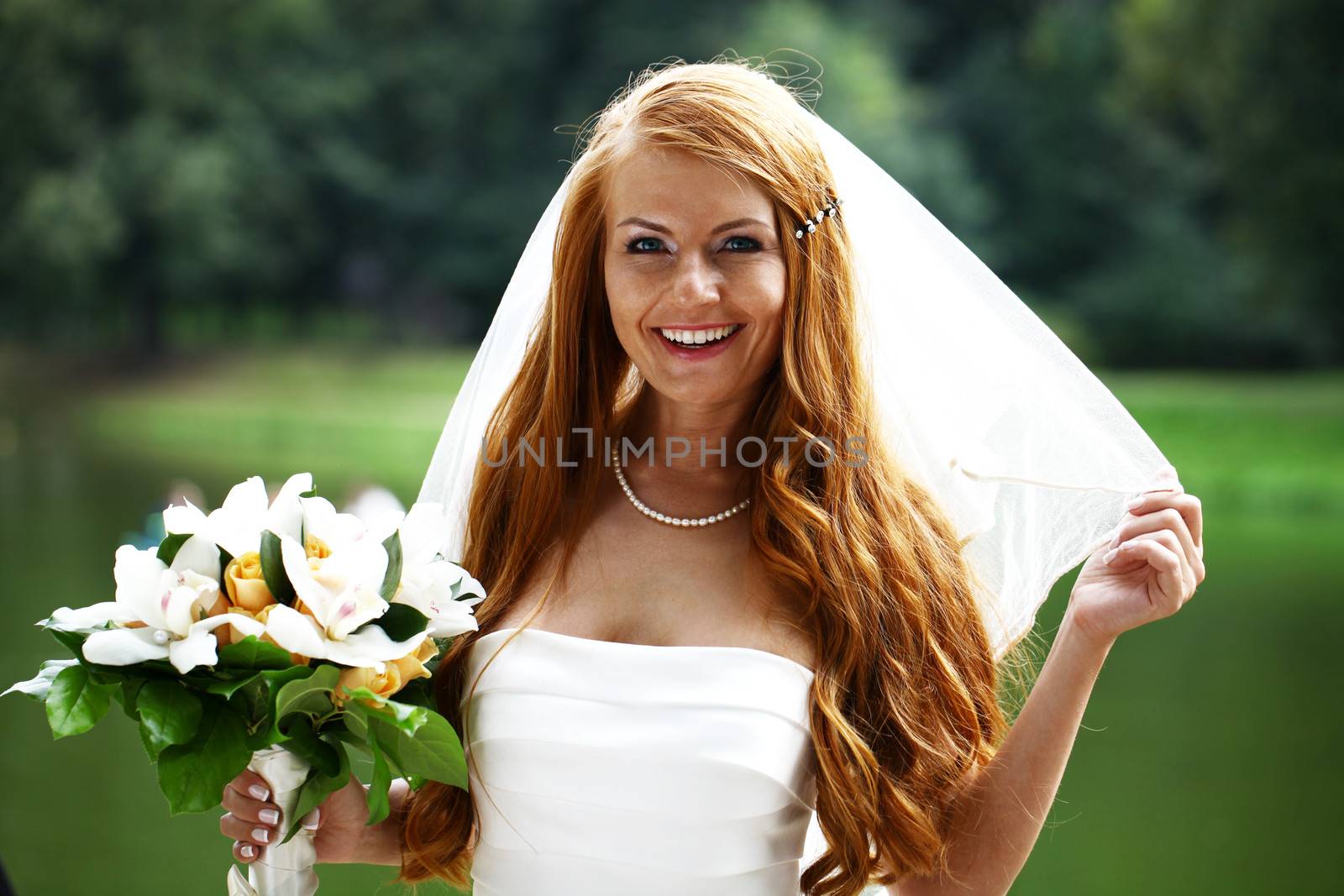 Portrait of beautiful bride with flowers