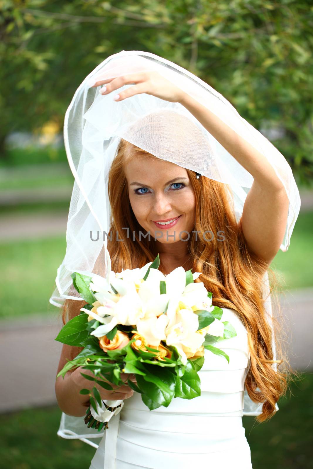 Portrait of beautiful bride with flowers