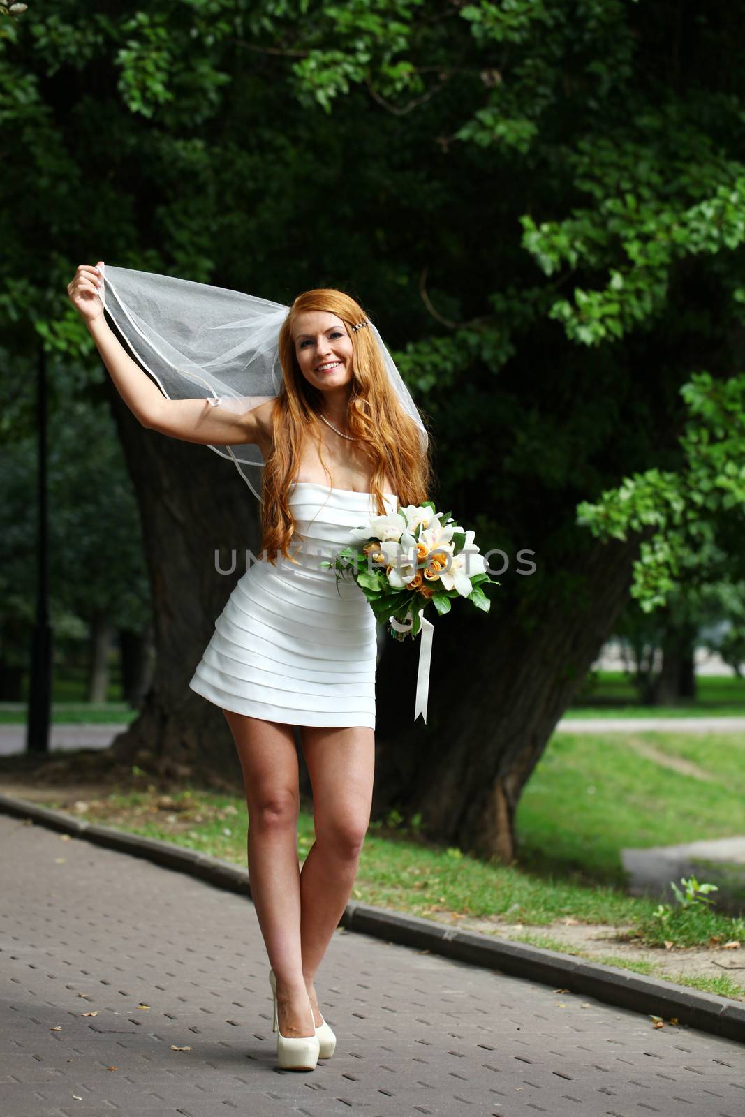 Beautiful red hair bride wearing wedding dress