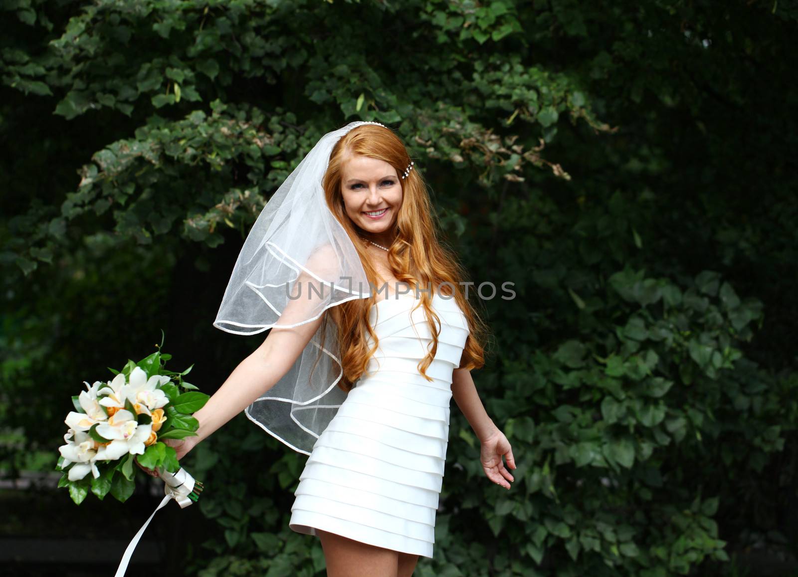 Portrait of beautiful bride with flowers