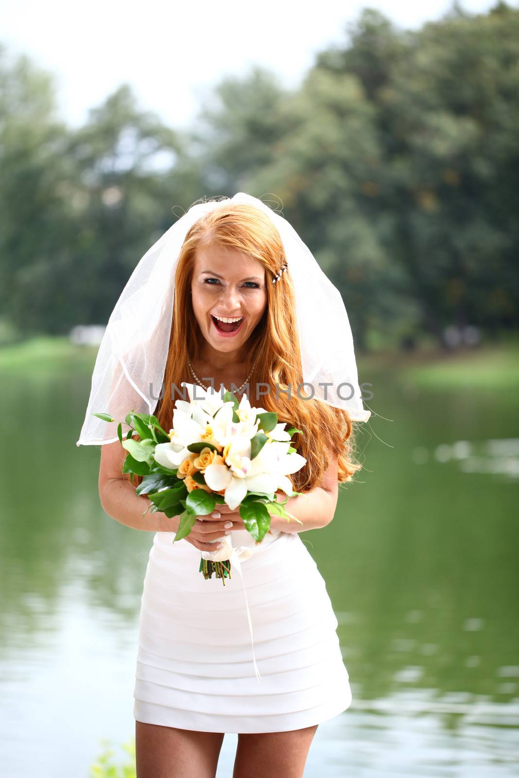 Portrait of beautiful bride with flowers