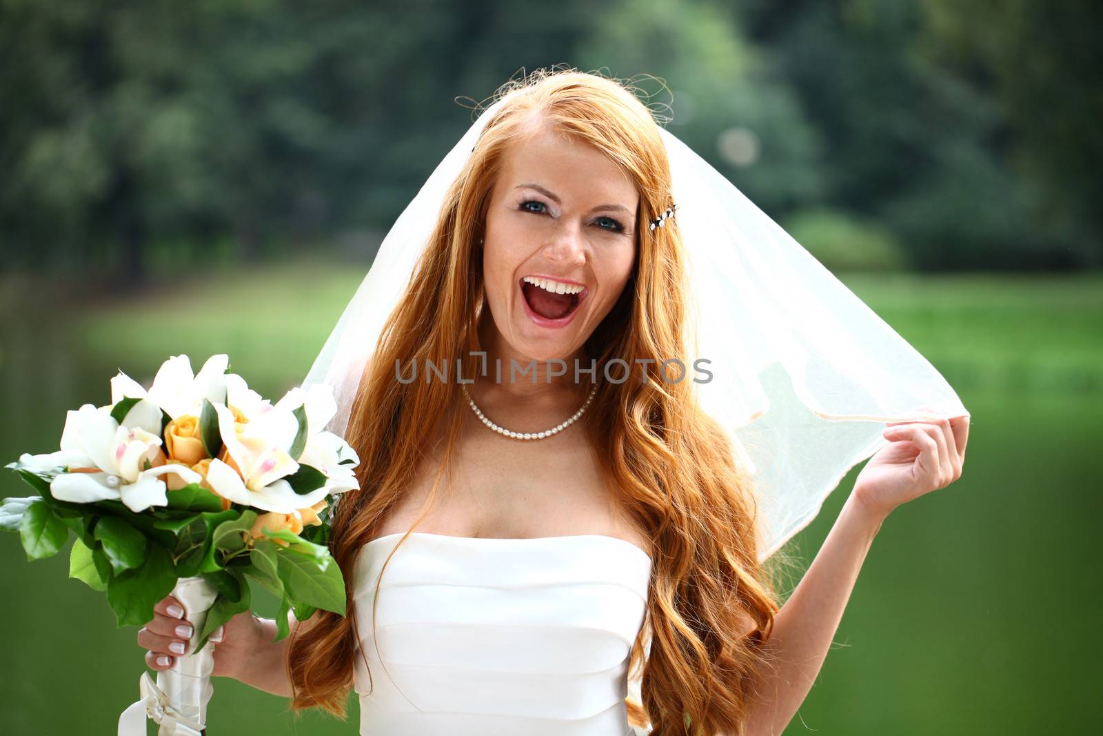 Portrait of beautiful bride with flowers