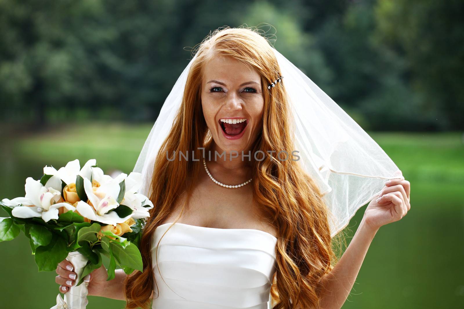 Portrait of beautiful bride with flowers