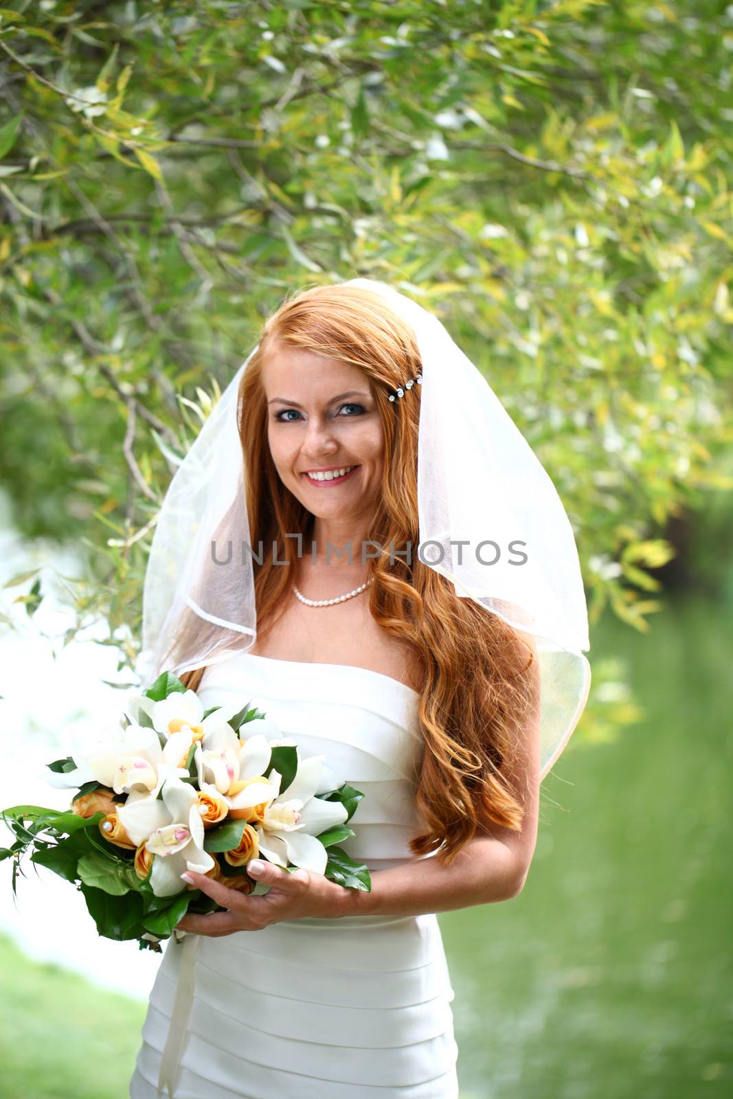 Portrait of beautiful bride with flowers