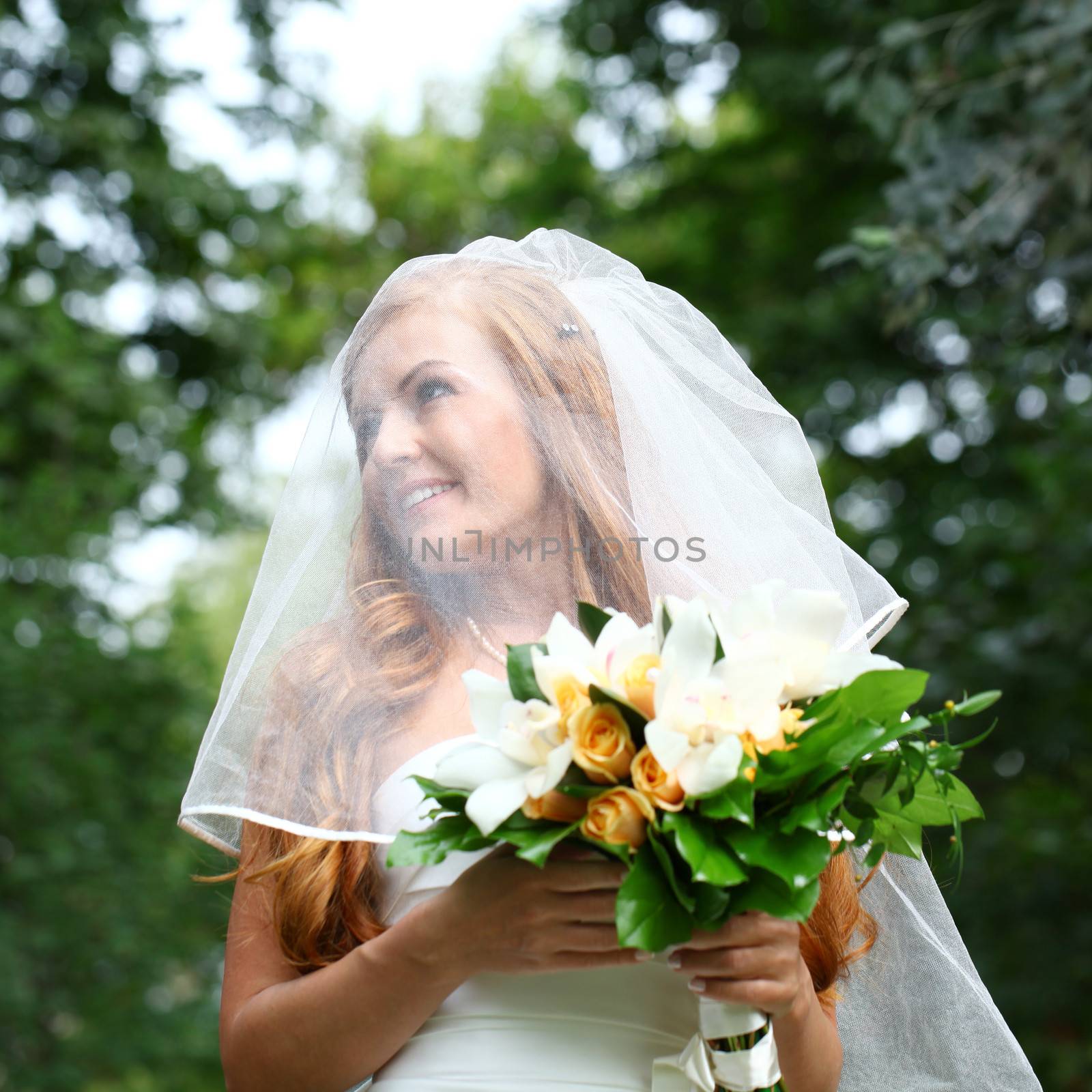 Portrait of beautiful bride with flowers