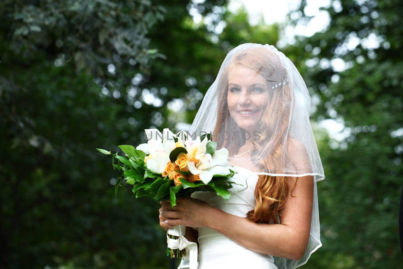 Portrait of beautiful bride with flowers