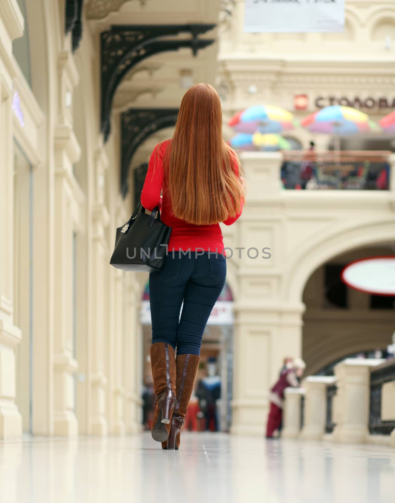 Woman walking in the shop by andersonrise