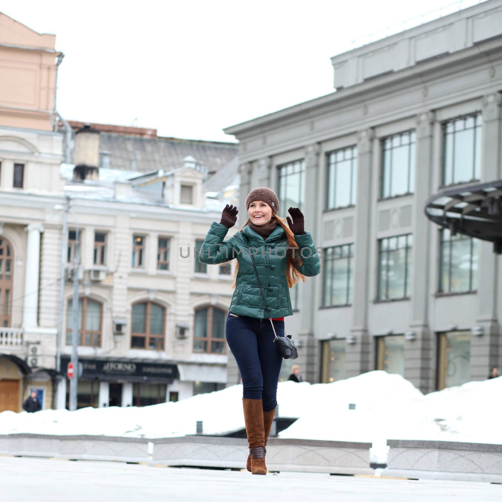 Walking woman in autumn Moscow street by andersonrise