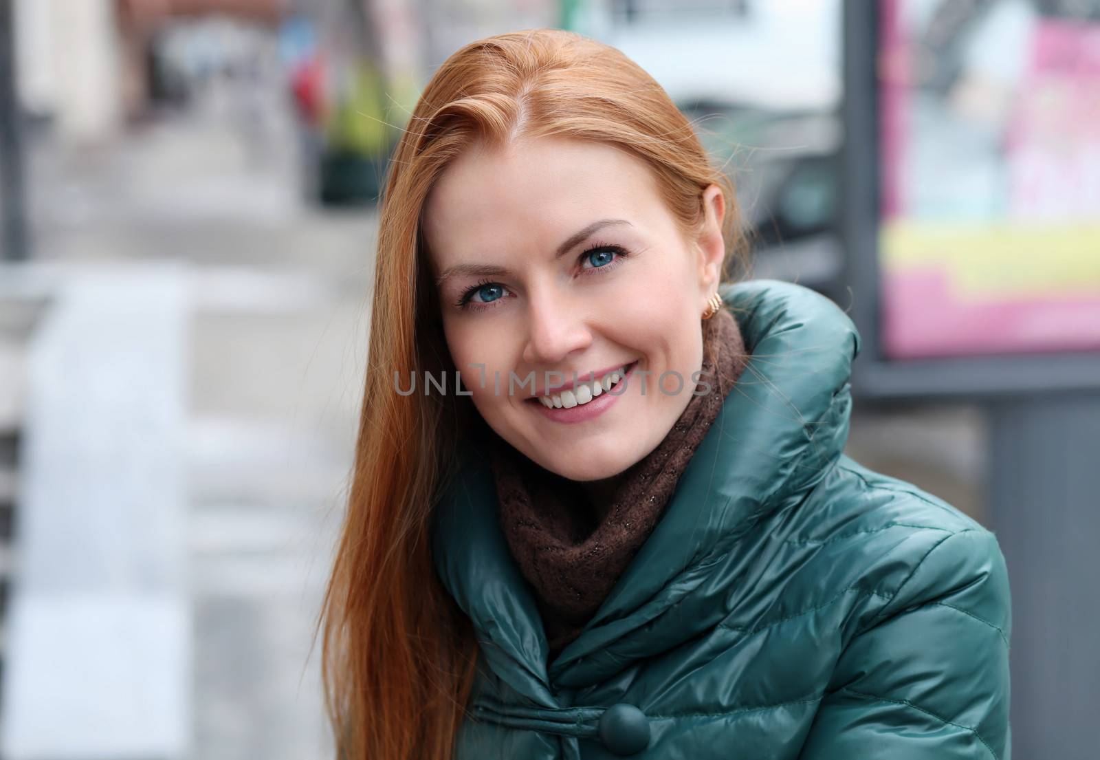 Happy young woman in autumn city