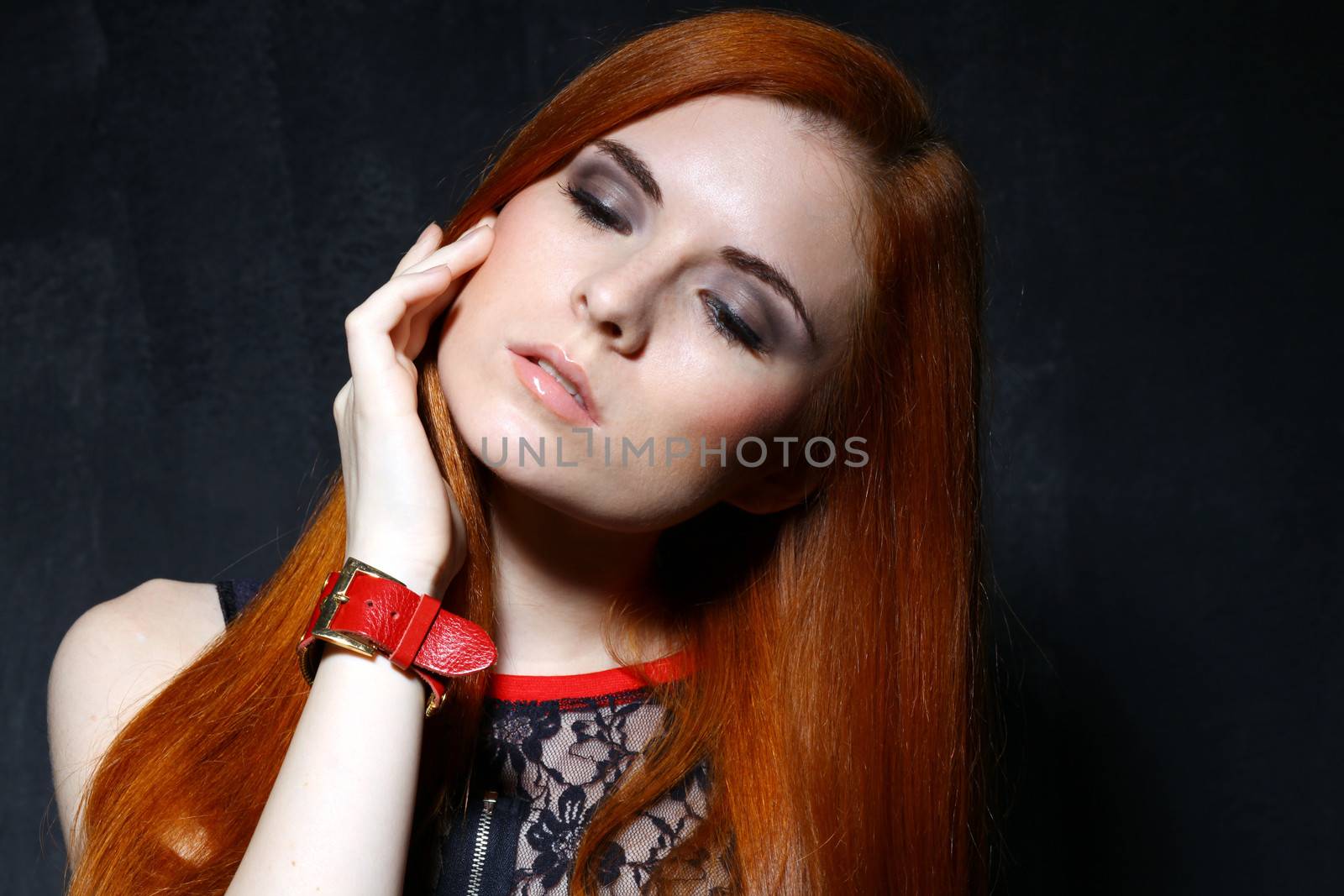 Young beautiful woman in studio by andersonrise