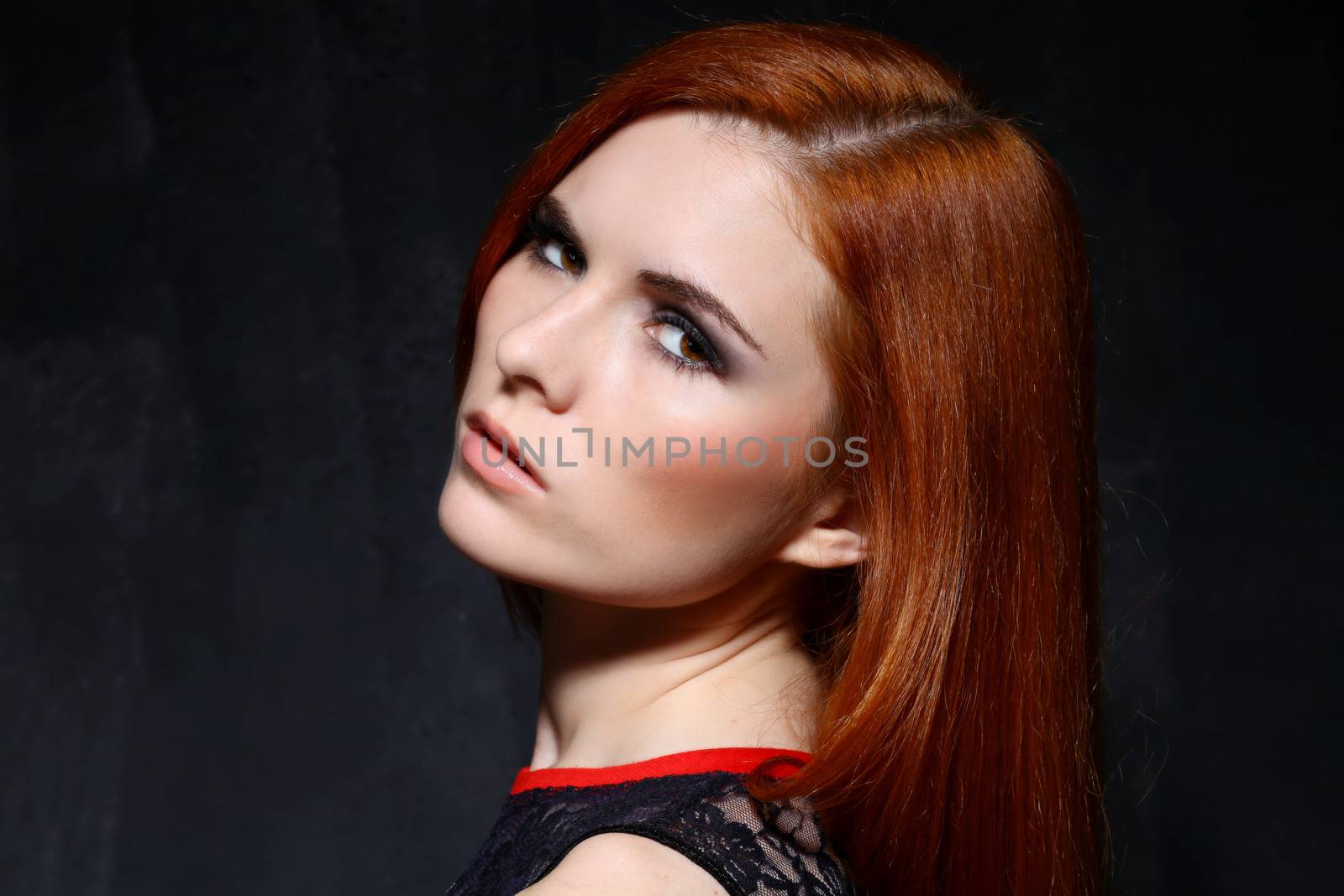 Young beautiful woman in studio by andersonrise