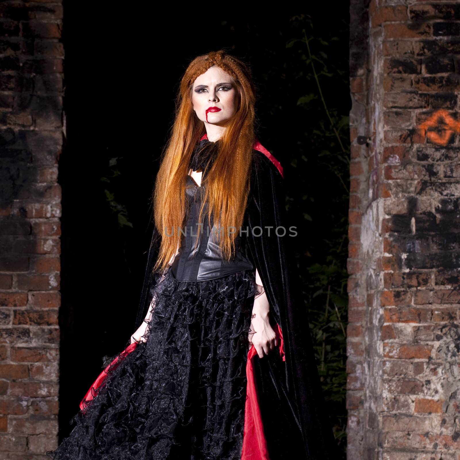 Terrible vampire woman in a red cloak by andersonrise