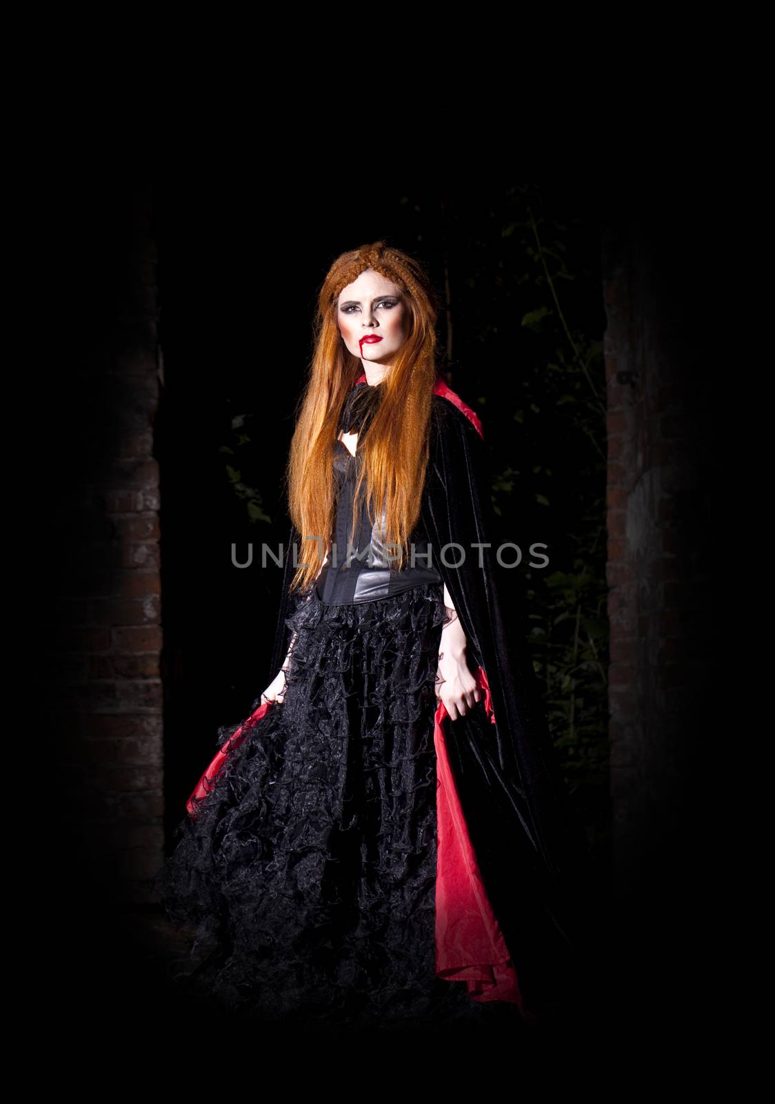 Terrible vampire woman in a red cloak by andersonrise